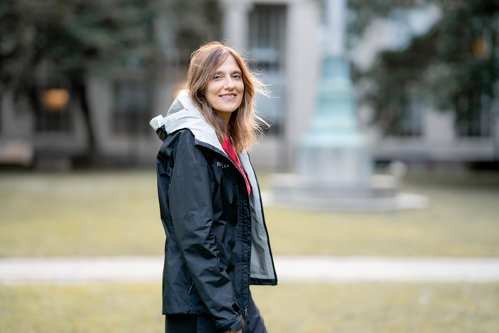 Regina Barzilay walks across the MIT campus